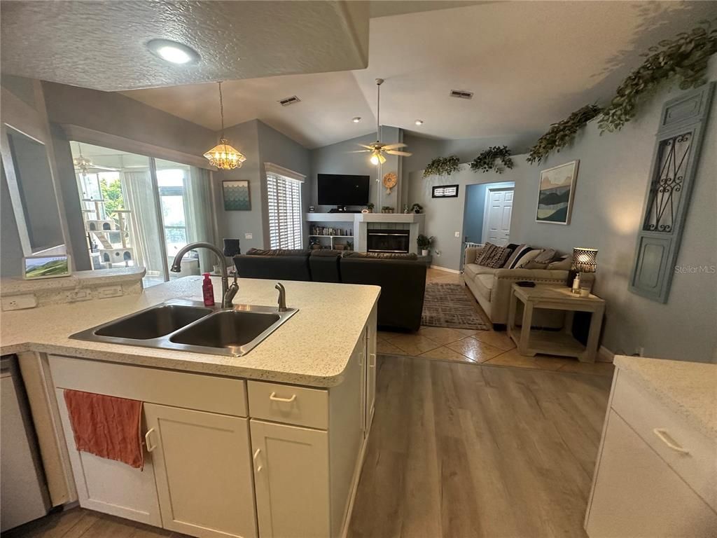 Fireplace, Interior, Kitchen, Living room, Pendant Lights, Recessed Lighting, Wood Texture Flooring