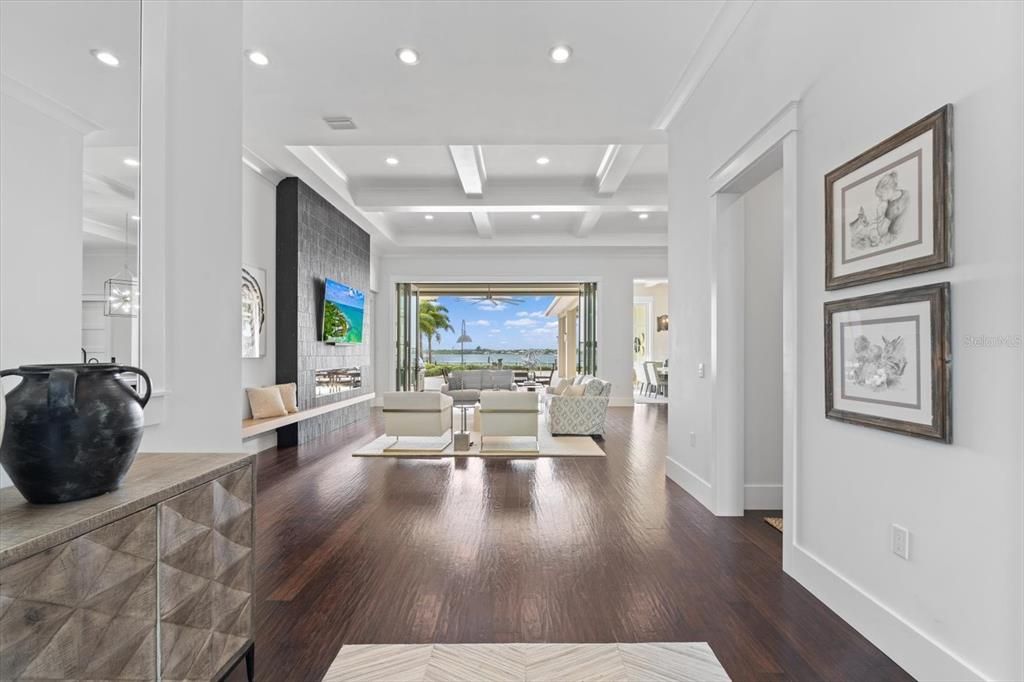Fireplace, Interior, Living room, Recessed Lighting, Water, Wood Texture Flooring
