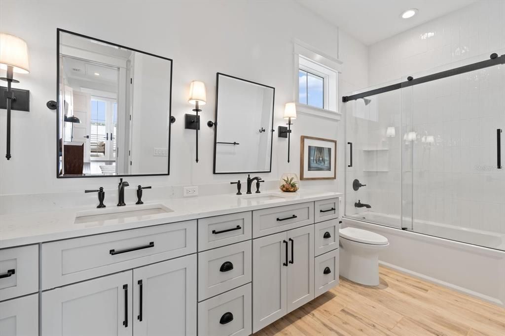 Bathroom, Dual Sink Vanities, Glass Shower, Interior, Recessed Lighting, Wood Texture Flooring