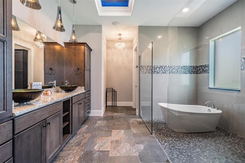 Bathroom, Chandelier, Dual Sink Vanities, Free Standing Baths, Glass Shower, Interior, Pendant Lights, Recessed Lighting