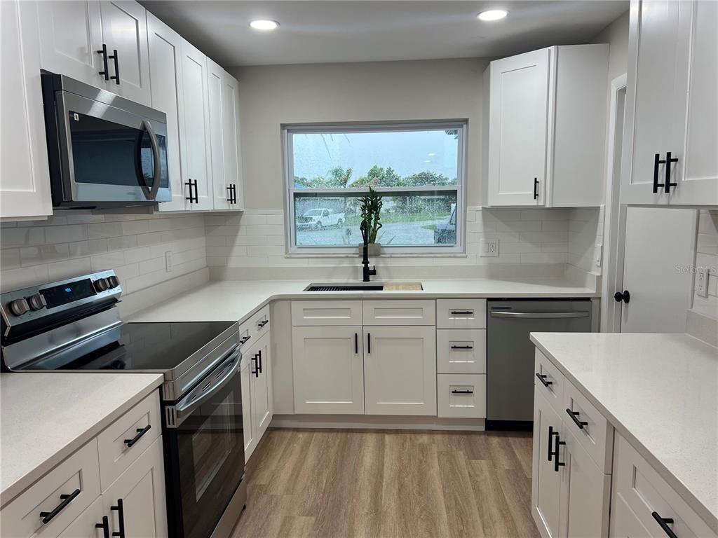 Interior, Kitchen, Recessed Lighting, Stainless Steel Appliances, Wood Texture Flooring