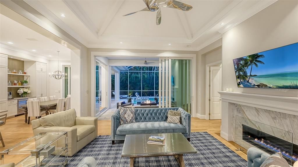 Chandelier, Dining room, Fireplace, Interior, Living room, Pendant Lights, Recessed Lighting, Water, Wood Texture Flooring