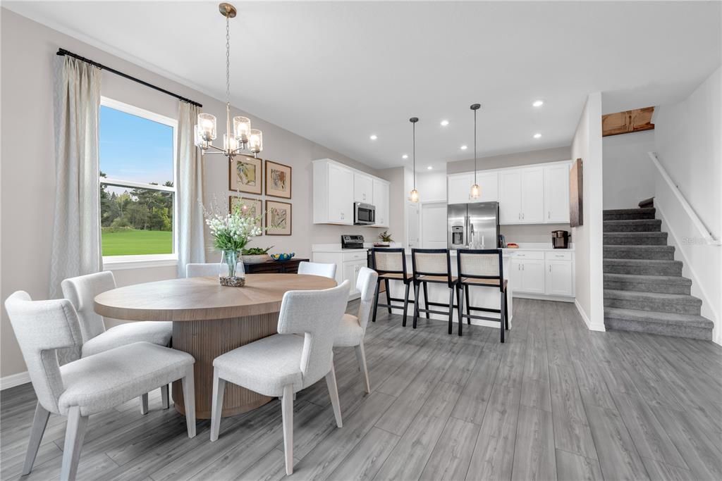 Chandelier, Dining room, Interior, Kitchen, Pendant Lights, Recessed Lighting, Stainless Steel Appliances, Wood Texture Flooring