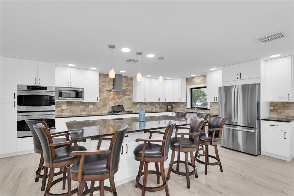 Interior, Kitchen, Pendant Lights, Recessed Lighting, Stainless Steel Appliances, Stone Walls, Wood Texture Flooring