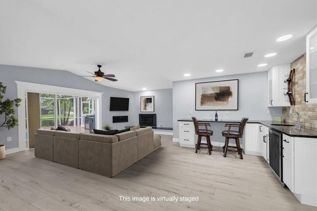 Dining room, Fireplace, Interior, Living room, Recessed Lighting, Wood Texture Flooring