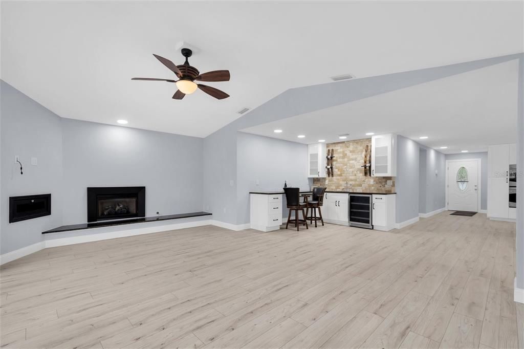 Empty room, Fireplace, Interior, Kitchen, Recessed Lighting, Wood Texture Flooring