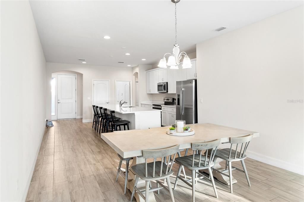 Dining room, Interior, Kitchen, Pendant Lights, Recessed Lighting, Stainless Steel Appliances, Wood Texture Flooring
