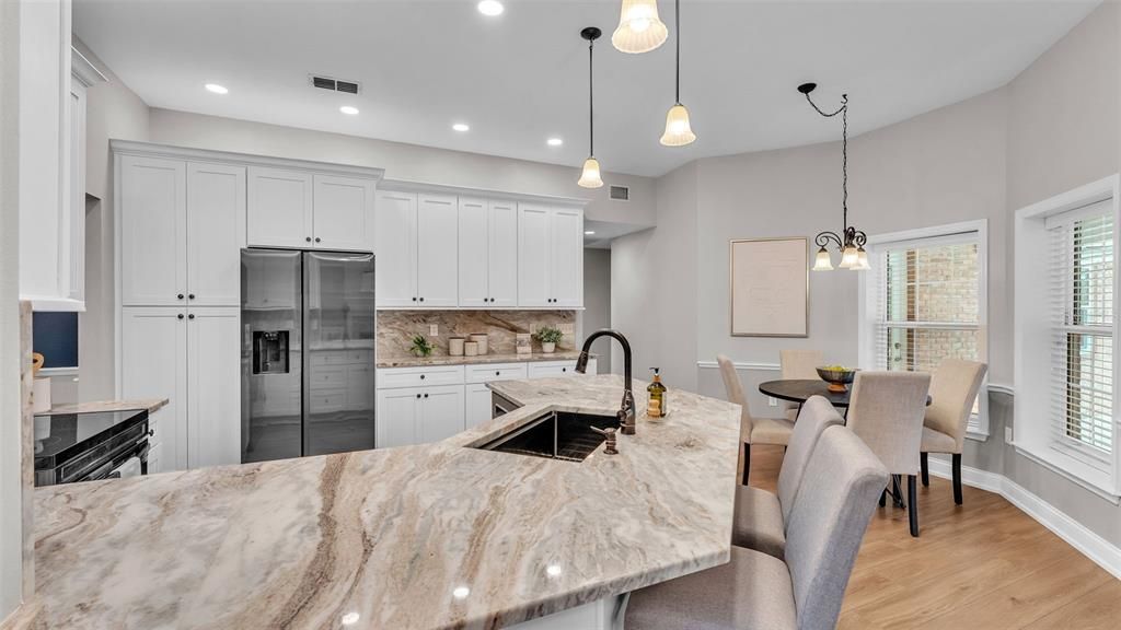Dining room, Interior, Kitchen, Pendant Lights, Recessed Lighting, Stainless Steel Appliances, Wood Texture Flooring
