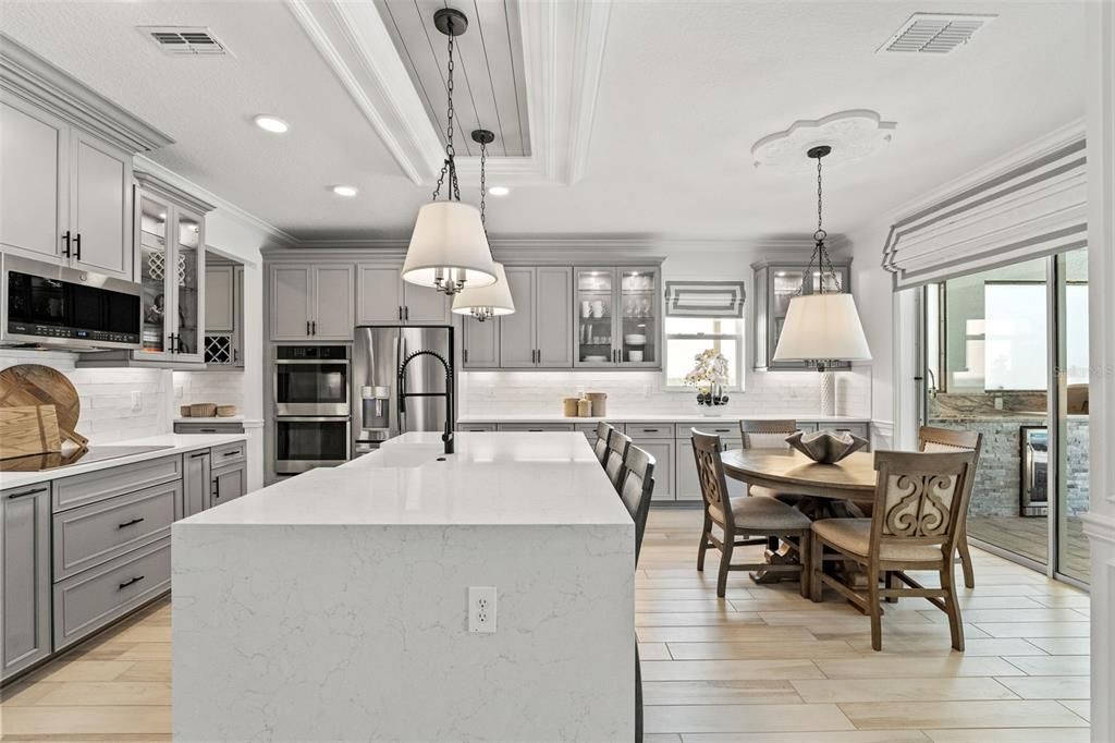 Dining room, Interior, Kitchen, Pendant Lights, Recessed Lighting, Stainless Steel Appliances, Wood Texture Flooring