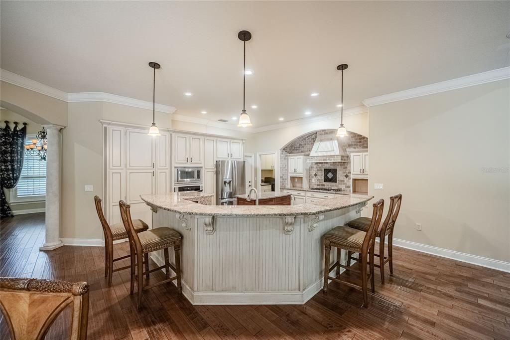 Fireplace, Interior, Kitchen, Pendant Lights, Recessed Lighting, Stainless Steel Appliances, Wood Texture Flooring