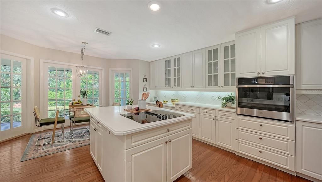 Dining room, Interior, Kitchen, Pendant Lights, Recessed Lighting, Stainless Steel Appliances, Wood Texture Flooring