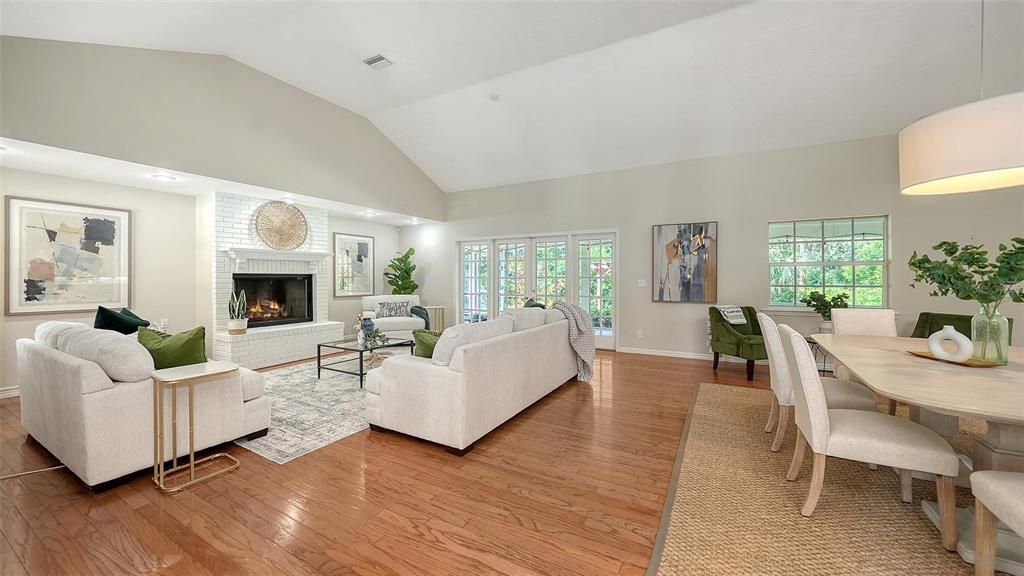Dining room, Fireplace, Interior, Living room, Recessed Lighting, Wood Texture Flooring