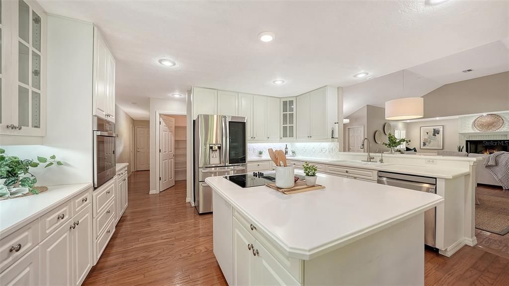 Fireplace, Interior, Kitchen, Pendant Lights, Recessed Lighting, Stainless Steel Appliances, Wood Texture Flooring