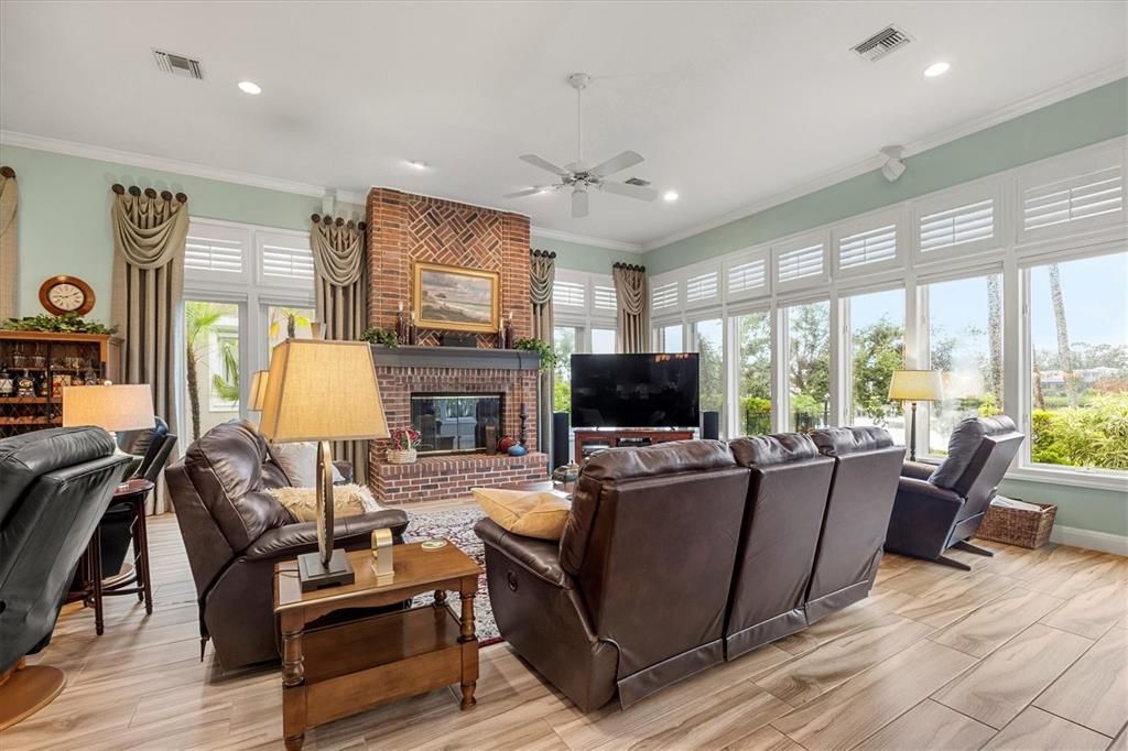 Fireplace, Interior, Living room, Recessed Lighting, Stone Walls, Wood Texture Flooring