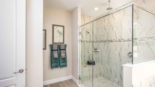 Bathroom, Glass Shower, Interior, Marble Walls, Recessed Lighting, Wood Texture Flooring