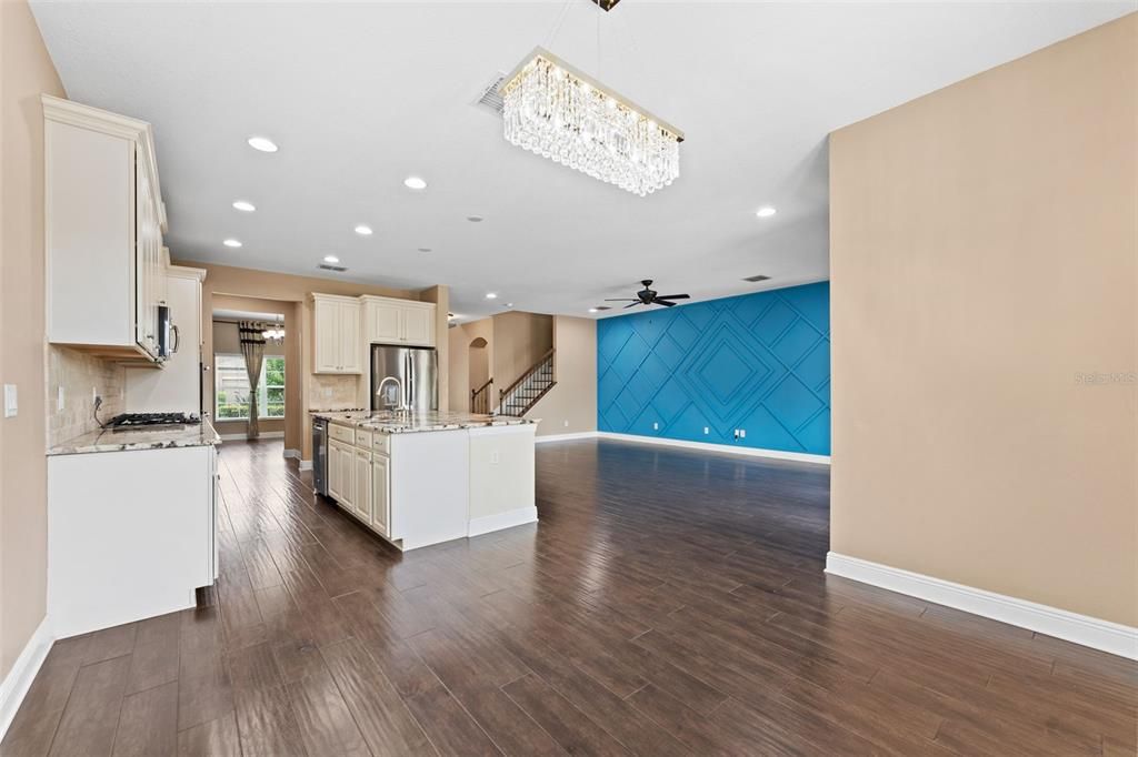 Chandelier, Empty room, Interior, Kitchen, Recessed Lighting, Stainless Steel Appliances, Wood Texture Flooring