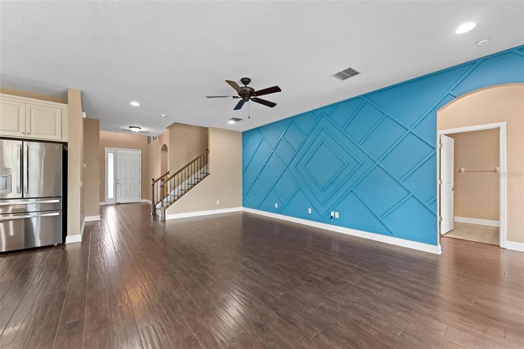 Empty room, Interior, Kitchen, Recessed Lighting, Stainless Steel Appliances, Wood Texture Flooring