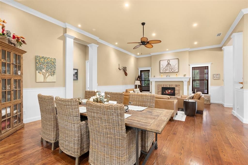Dining room, Fireplace, Interior, Living room, Recessed Lighting, Wood Texture Flooring