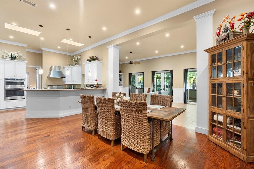 Dining room, Interior, Kitchen, Pendant Lights, Recessed Lighting, Stainless Steel Appliances, Wood Texture Flooring