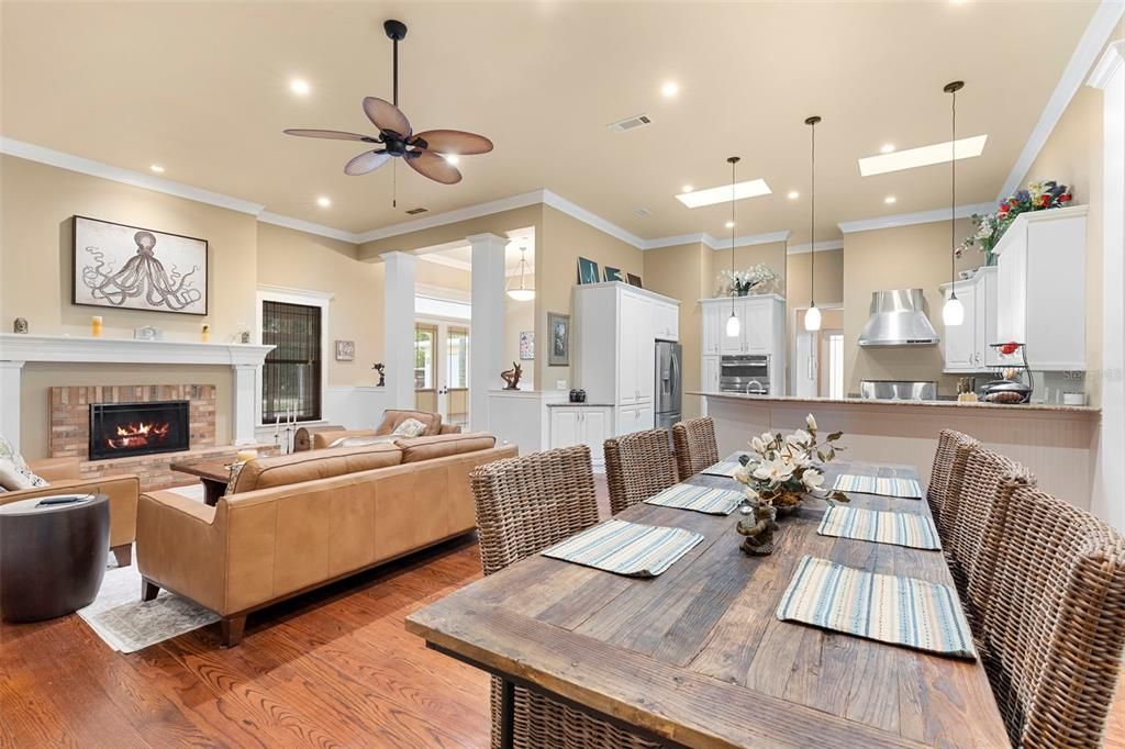 Fireplace, Interior, Kitchen, Living room, Pendant Lights, Recessed Lighting, Stainless Steel Appliances, Wood Texture Flooring