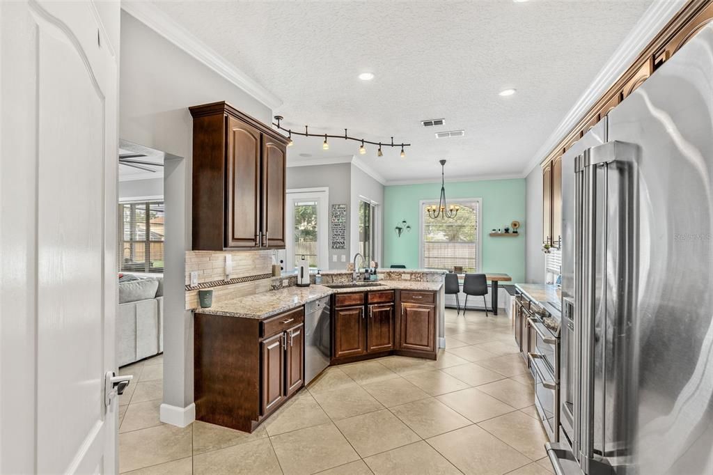 Chandelier, Dining room, Interior, Kitchen, Recessed Lighting, Stainless Steel Appliances