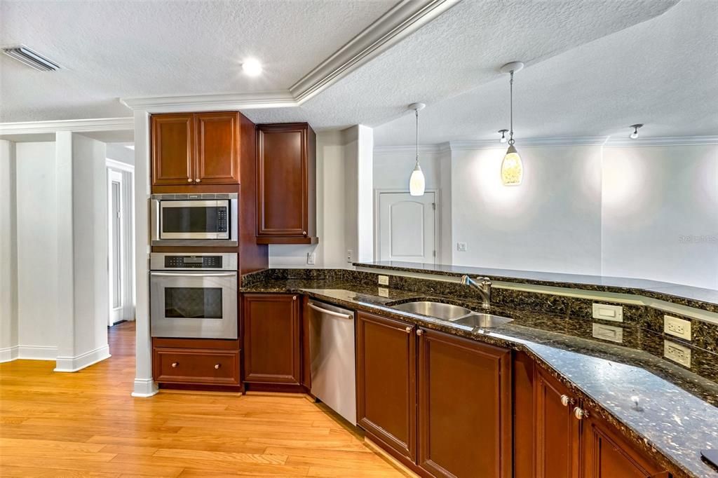 Interior, Kitchen, Pendant Lights, Recessed Lighting, Stainless Steel Appliances, Wood Texture Flooring