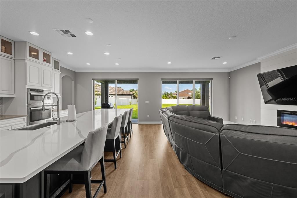 Fireplace, Interior, Kitchen, Living room, Recessed Lighting, Wood Texture Flooring