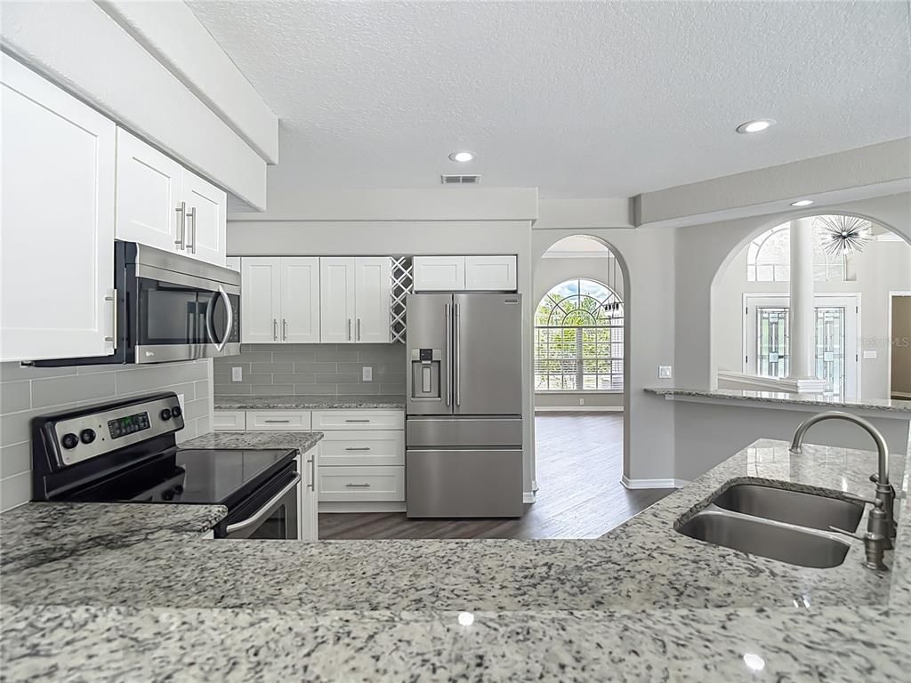 Interior, Kitchen, Recessed Lighting, Stainless Steel Appliances, Wood Texture Flooring
