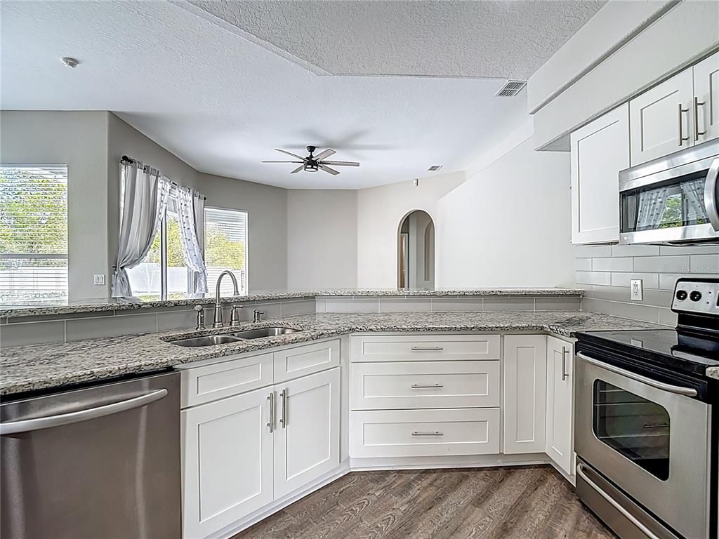 Interior, Kitchen, Recessed Lighting, Stainless Steel Appliances, Wood Texture Flooring