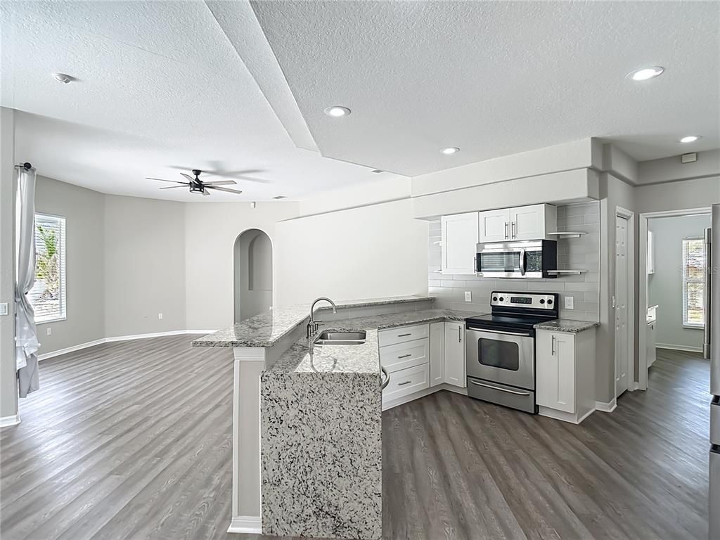 Interior, Kitchen, Recessed Lighting, Stainless Steel Appliances, Wood Texture Flooring
