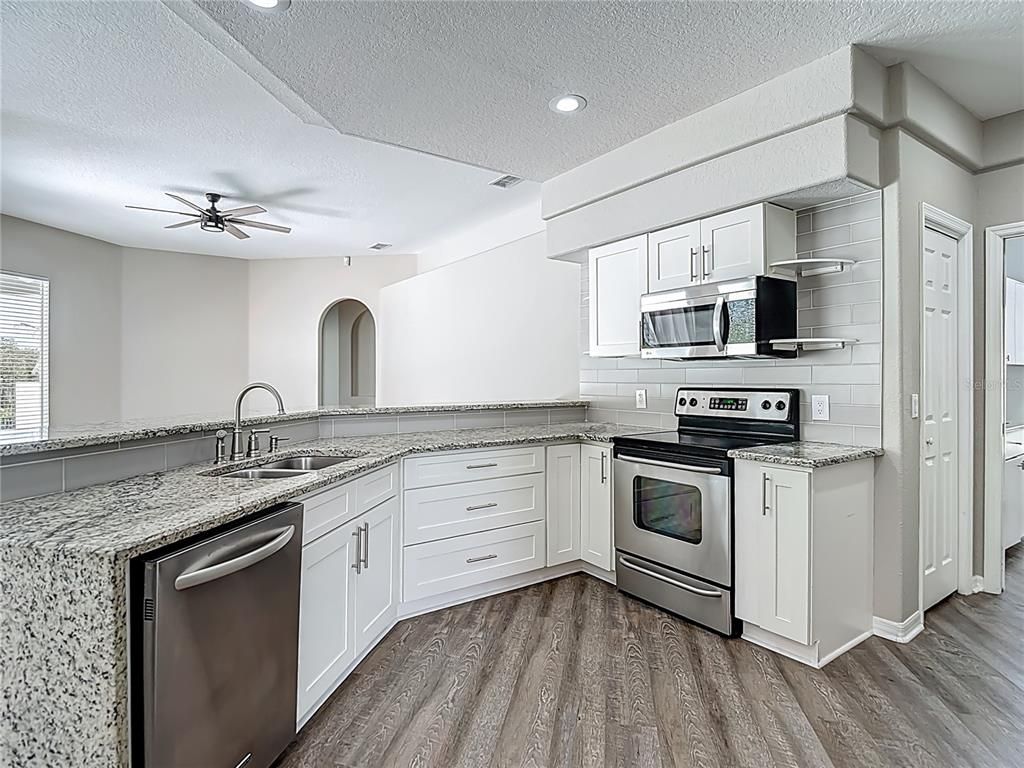 Interior, Kitchen, Recessed Lighting, Stainless Steel Appliances, Wood Texture Flooring
