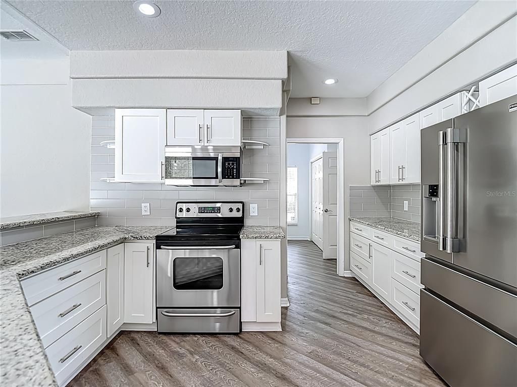 Interior, Kitchen, Recessed Lighting, Stainless Steel Appliances, Wood Texture Flooring