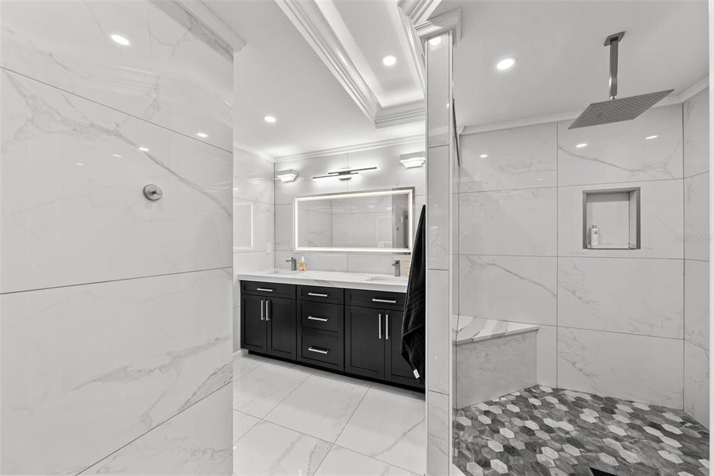 Bathroom, Dual Sink Vanities, Glass Shower, Interior, Marble, Marble Walls, Recessed Lighting