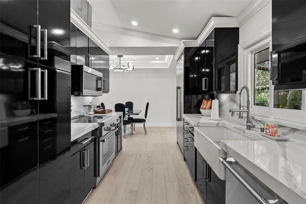 Chandelier, Dining room, Interior, Kitchen, Pendant Lights, Recessed Lighting, Stainless Steel Appliances, Wood Texture Flooring