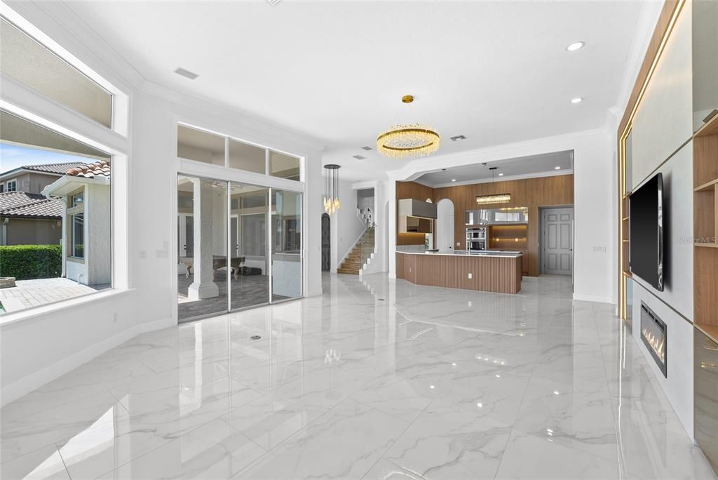 Chandelier, Fireplace, Interior, Kitchen, Marble, Pendant Lights, Recessed Lighting, Stainless Steel Appliances