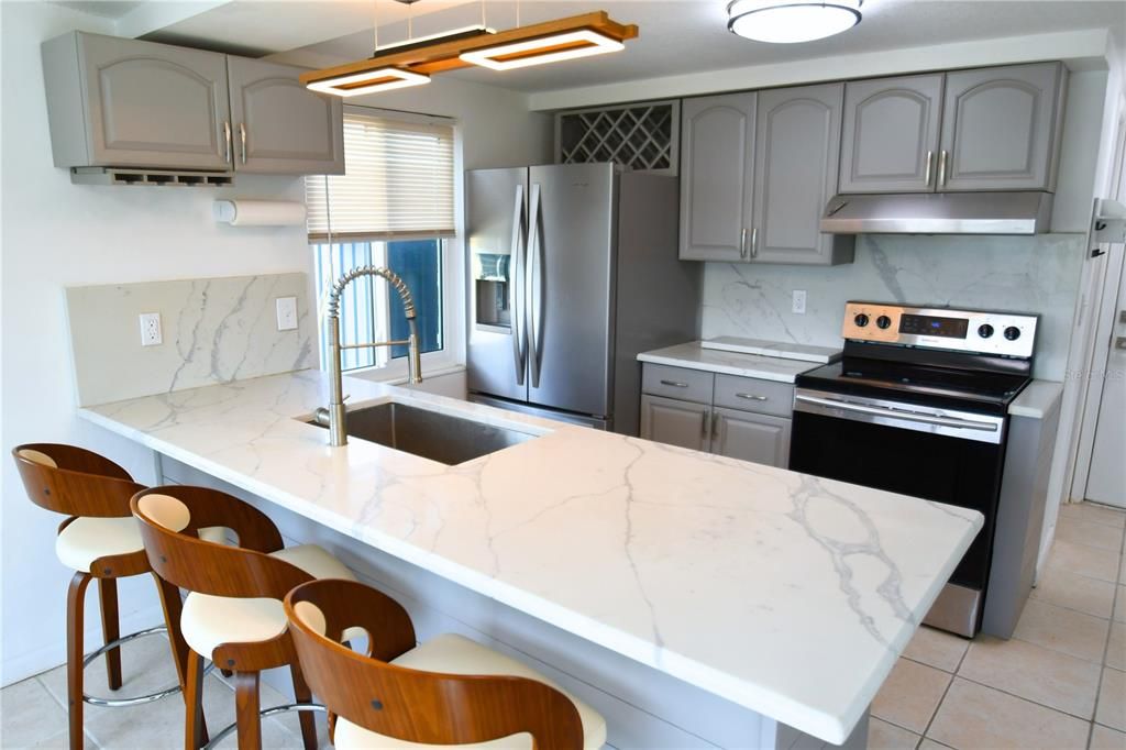 Interior, Kitchen, Marble Walls, Pendant Lights, Stainless Steel Appliances