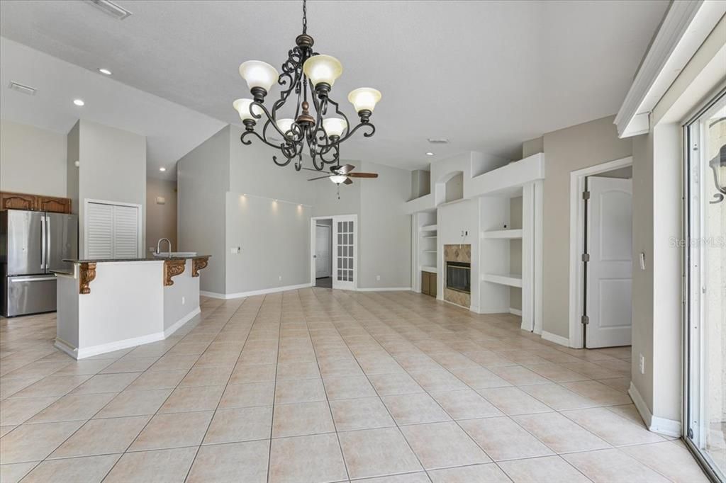 Chandelier, Empty room, Fireplace, Interior, Kitchen, Recessed Lighting, Stainless Steel Appliances
