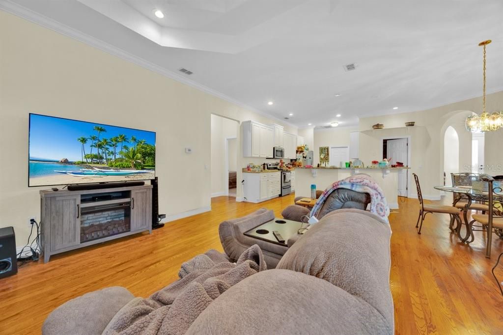 Chandelier, Dining room, Interior, Kitchen, Living room, Pendant Lights, Recessed Lighting, Wood Texture Flooring