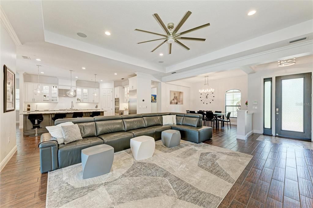 Chandelier, Dining room, Interior, Kitchen, Living room, Pendant Lights, Recessed Lighting, Stainless Steel Appliances, Wood Texture Flooring