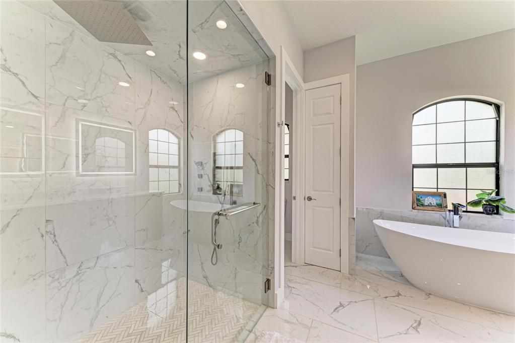 Bathroom, Free Standing Baths, Glass Shower, Interior, Marble, Marble Walls, Recessed Lighting