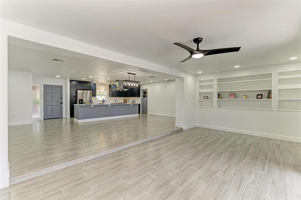 Empty room, Interior, Kitchen, Pendant Lights, Recessed Lighting, Stainless Steel Appliances, Wood Texture Flooring