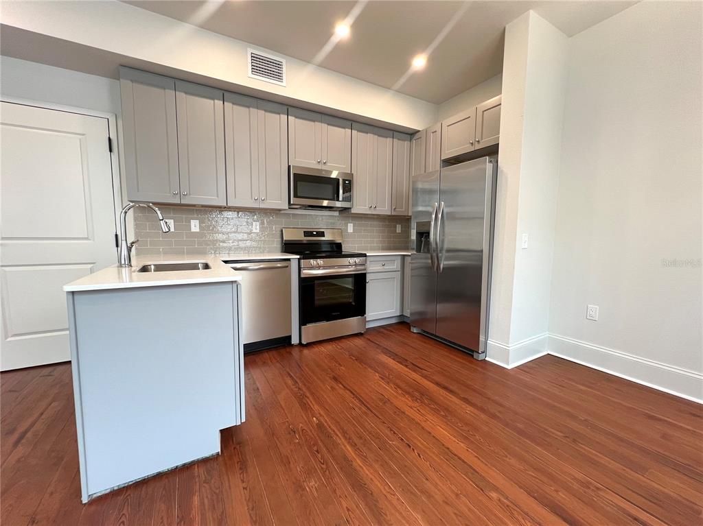 Interior, Kitchen, Recessed Lighting, Stainless Steel Appliances, Wood Texture Flooring