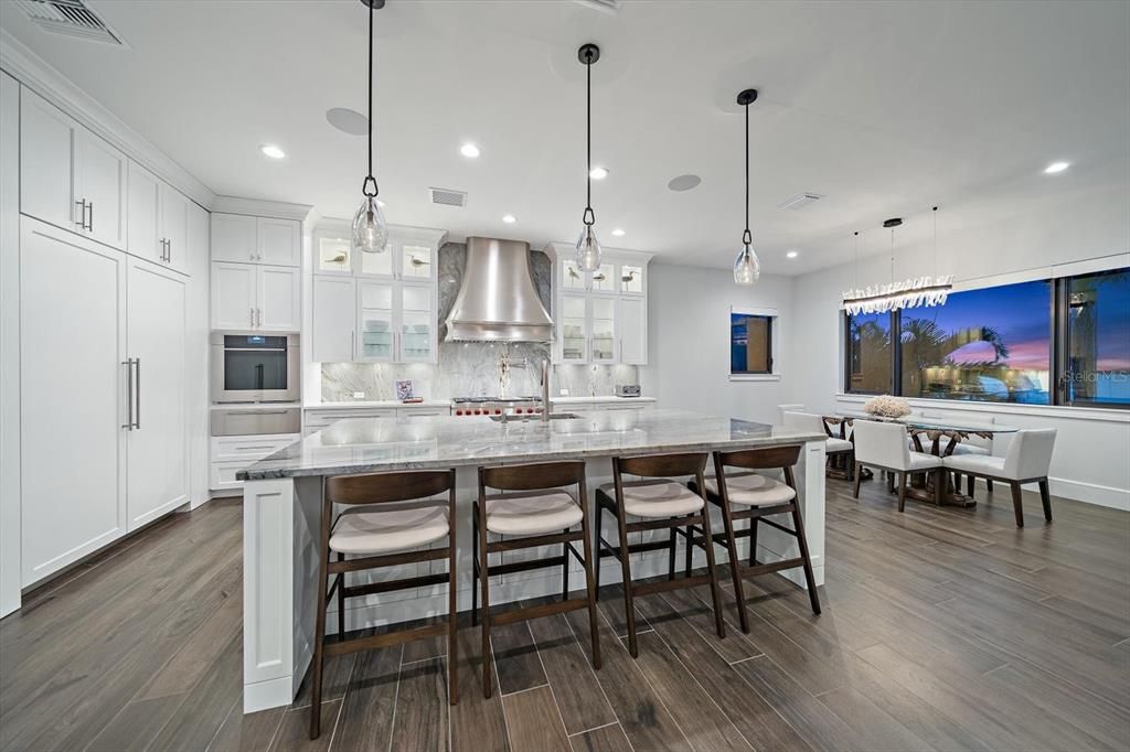 Dining room, Interior, Kitchen, Pendant Lights, Recessed Lighting, Stainless Steel Appliances, Water, Wood Texture Flooring