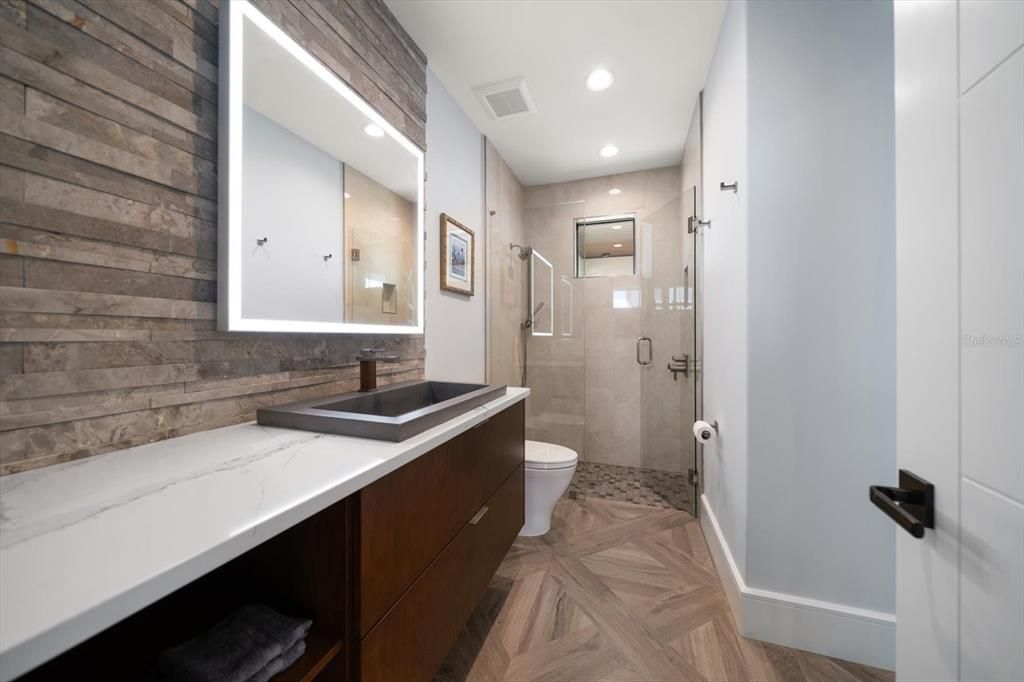 Bathroom, Glass Shower, Interior, Recessed Lighting, Wood Texture Flooring, Wooden Walls