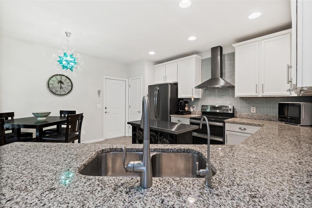 Chandelier, Dining room, Interior, Kitchen, Recessed Lighting, Stainless Steel Appliances