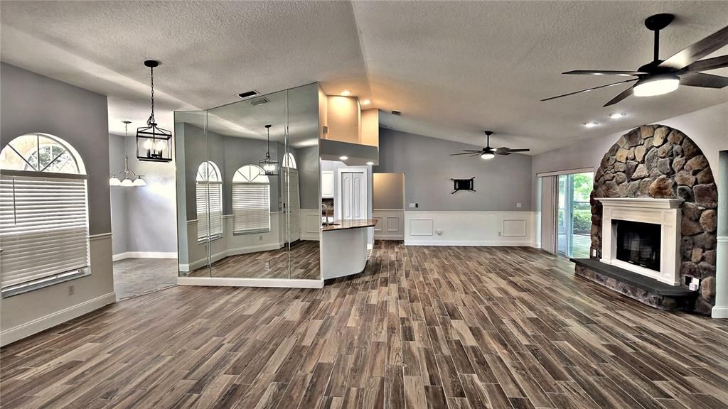 Fireplace, Interior, Pendant Lights, Recessed Lighting, Stone Walls, Wood Texture Flooring