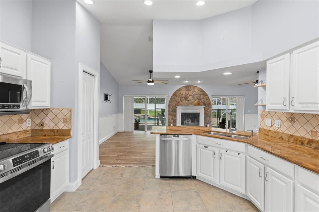 Fireplace, Interior, Kitchen, Recessed Lighting, Stainless Steel Appliances