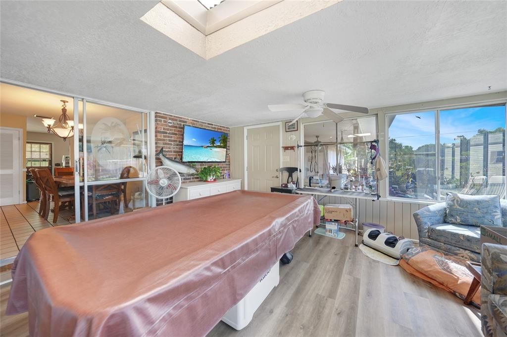 Billiard Table, Chandelier, Dining room, Fitness Equipment, Game Room, Interior, Stone Walls, Wood Texture Flooring