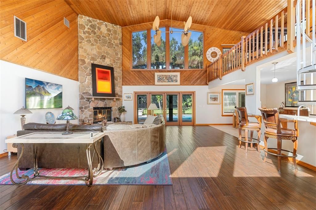 Dining room, Fireplace, Interior, Living room, Pendant Lights, Stone Walls, Wooden Ceilings, Wood Texture Flooring