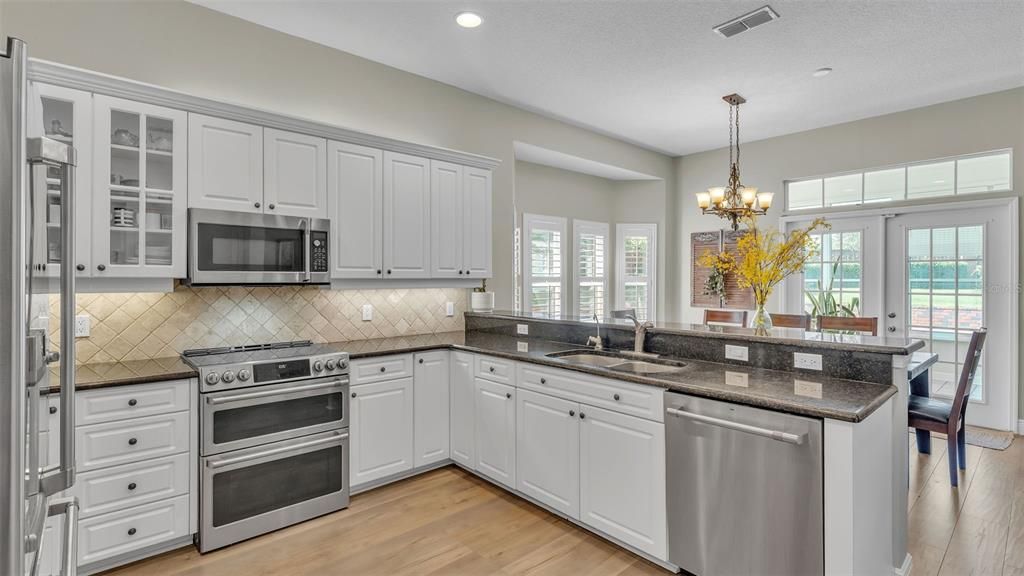 Chandelier, Interior, Kitchen, Recessed Lighting, Stainless Steel Appliances, Wood Texture Flooring